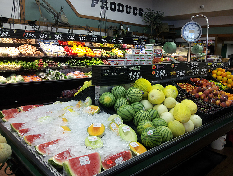 Anderson's Grocery produce section with watermelons in the foreground.