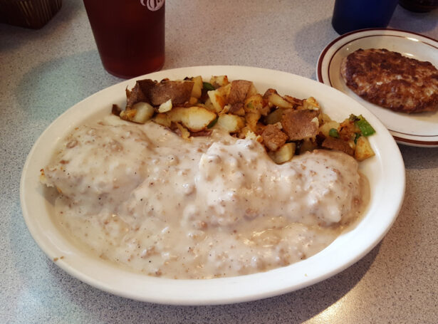 Old-fashioned biscuits and gravy, served up with tasty potatoes O’Brien, and a side of sausage. 