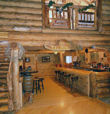 Log walls and wood floors impart a beautiful Western atmosphere to the restaurant and bar.