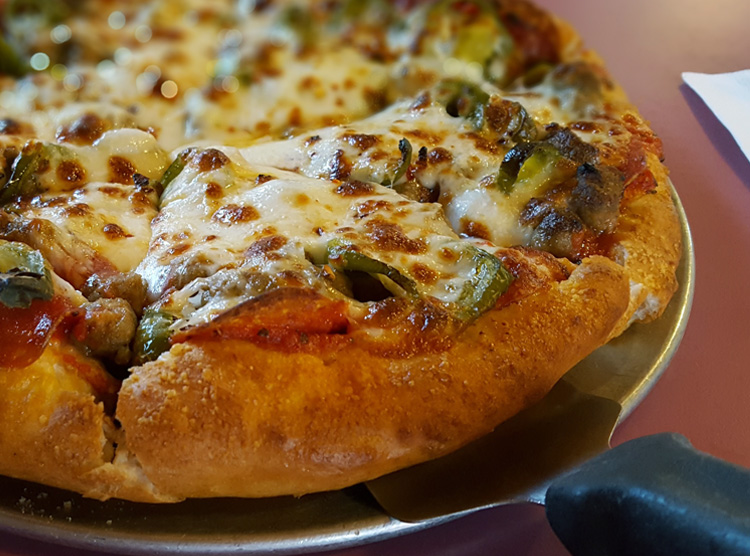 Steve O’s pizza of sausage, pepperoni, and jalapenos.