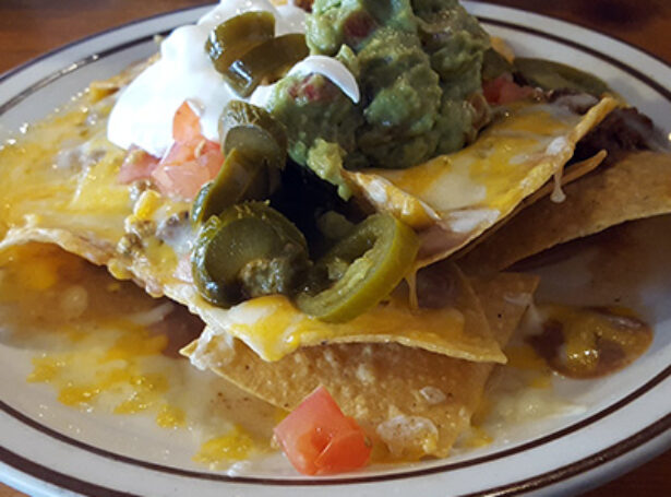 A scrumptious half order of Esther's nachos. They have all your favorite specialty dishes, plus they offer vegetarian dishes.